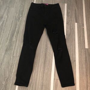 Distressed black high rise skinny jeans